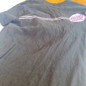 Black shirt with purple Sana cruise logo on front and back.